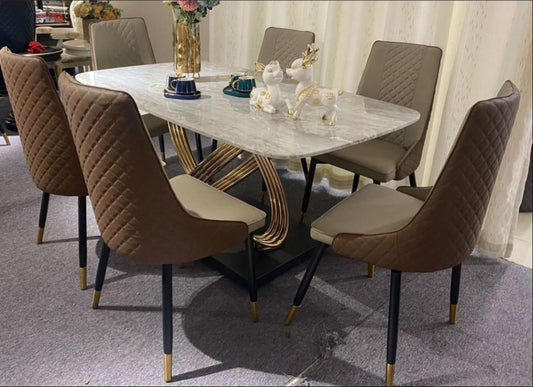 Table de salle à manger avec plateau en marbre et piètement en X doré