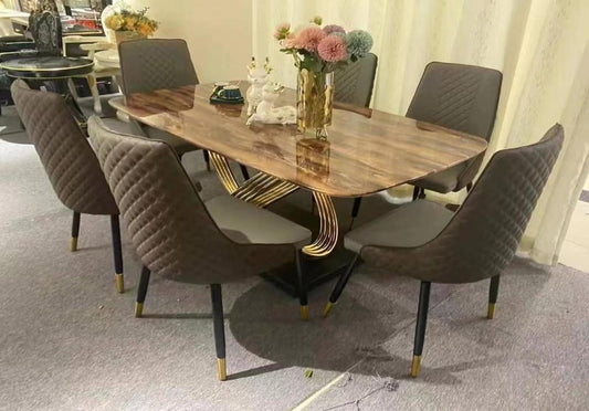 Table de salle à manger avec plateau en marbre marron et piètement en X doré